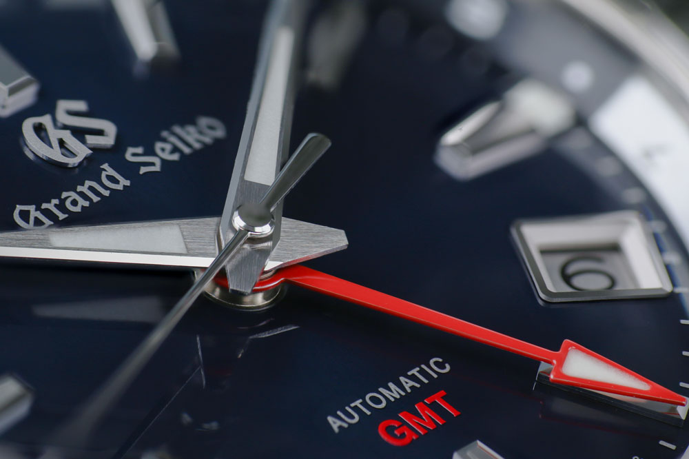 Grand Seiko SBGM245 blue-dialed GMT watch detail