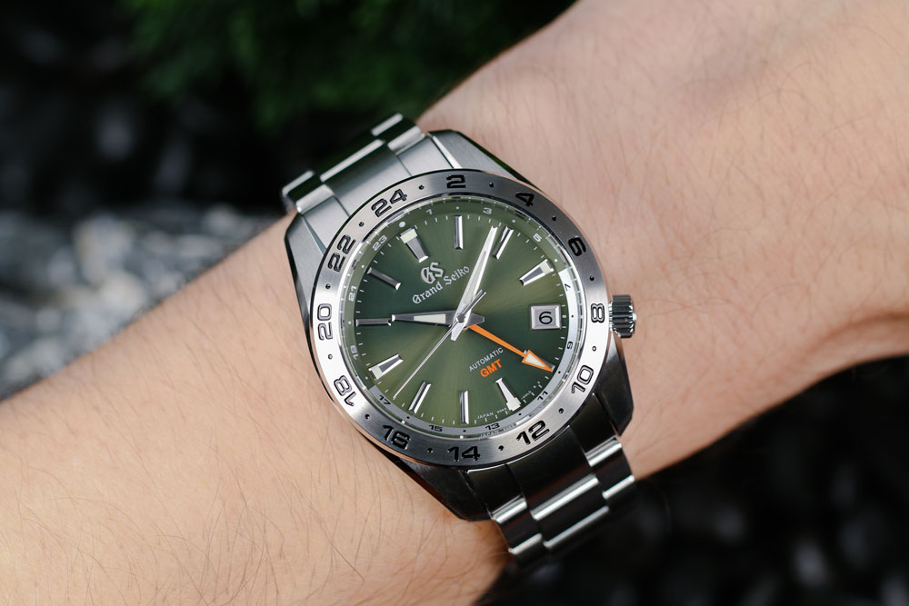 Grand Seiko SBGM247 green-dialed GMT watch on the wrist